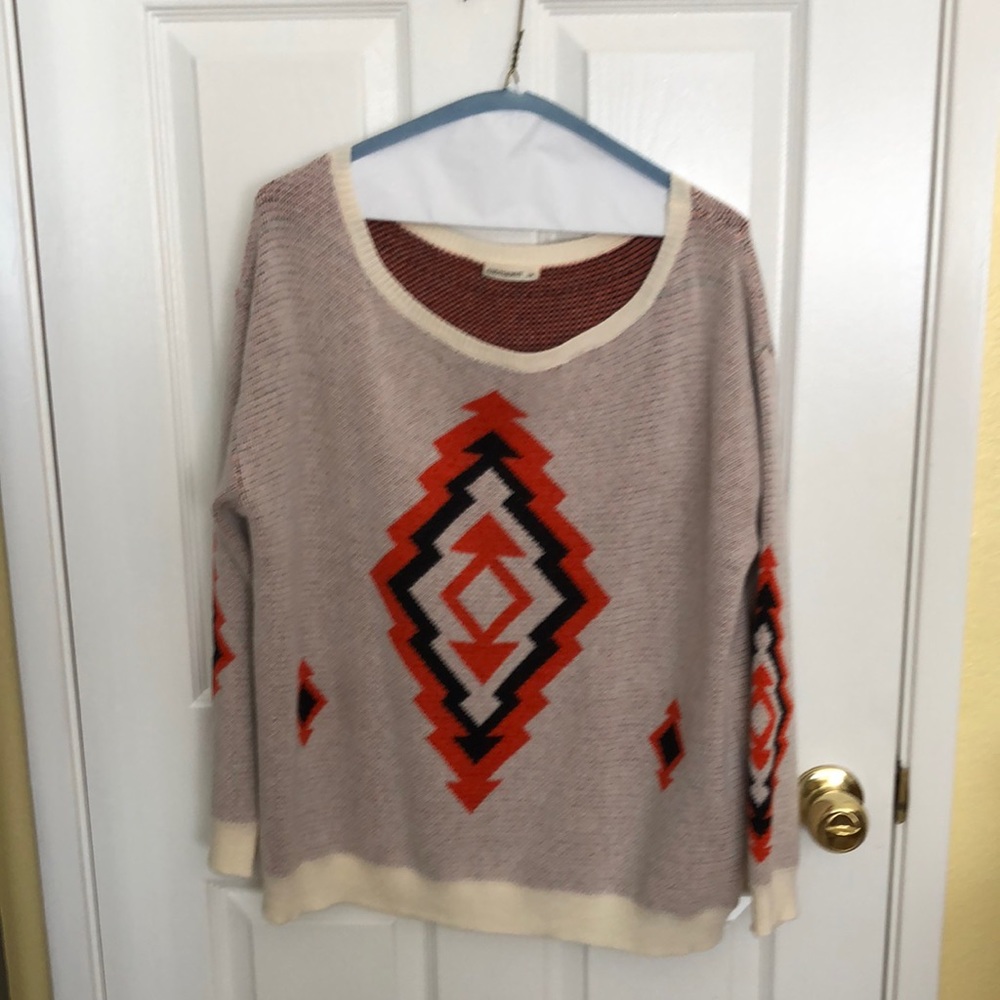 Aztec printed sweater size s/m with rust/ black with neutral background